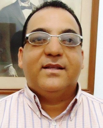 Licenciado John Grullón